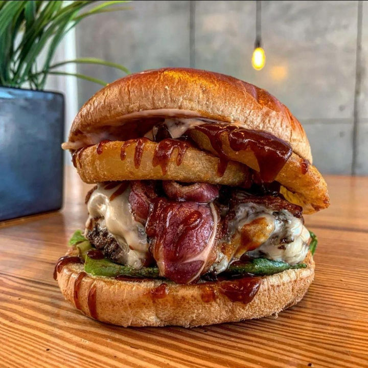 An Urban Skillet burger with a toasted bun and melted cheese